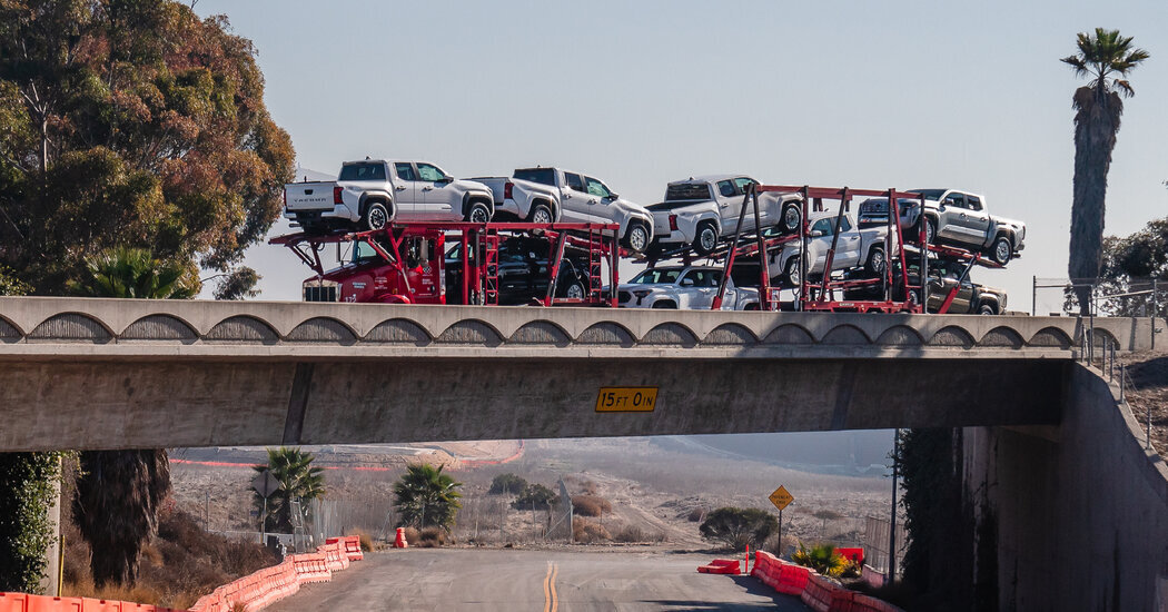 A cargo carrier taking trucks toward an inspection facility near the Mexican border in February.