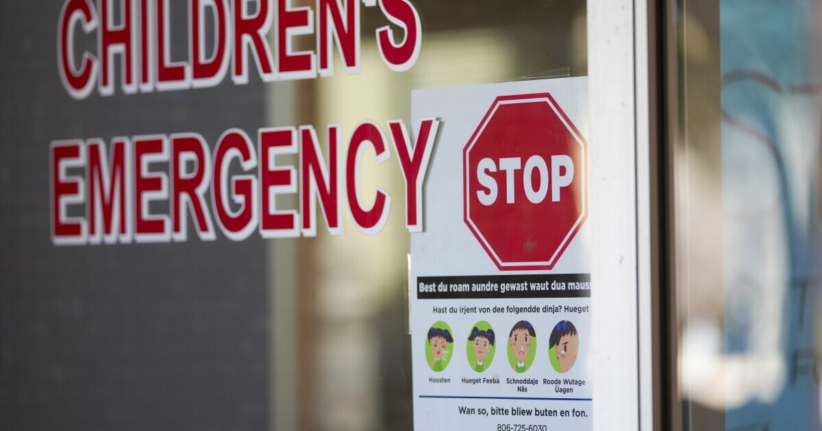 A sign is posted in German at the entrance of the children's emergency room at Covenant Children's Hospital, Tuesday, Feb. 25, 2025, in Lubbock, Texas.