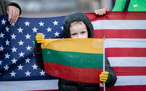 Lithuanians gather outside US Embassy to grieve American soldiers who died in training accident