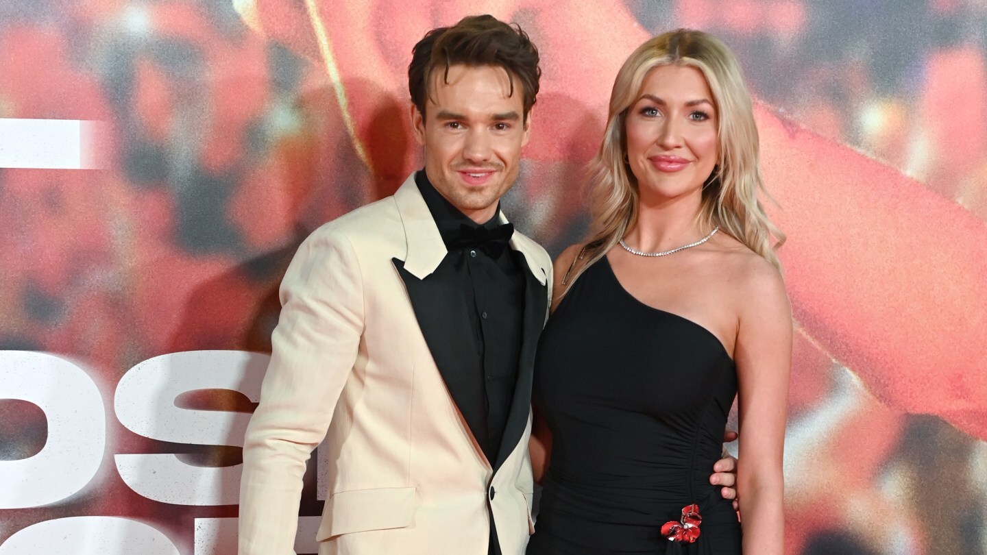 Liam Payne and Kate Cassidy pose together at a premiere in the U.K.