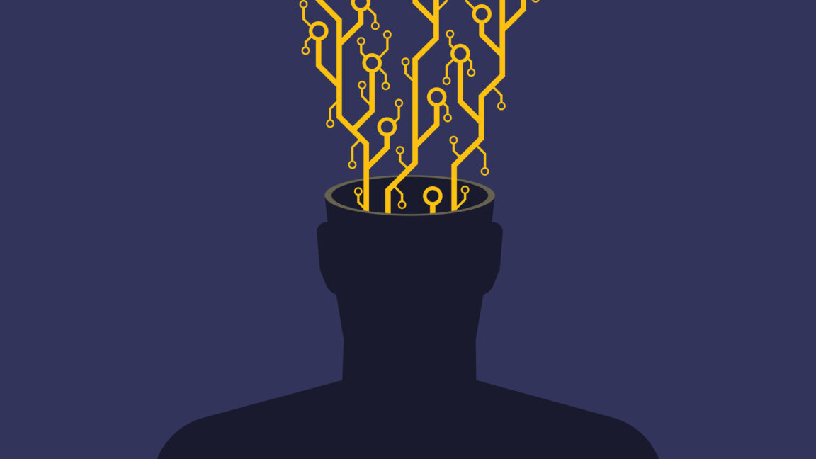 An image of a faceless human silhouette (chest up) with exposed microchip contacts and circuitry erupting from its open head. This visual metaphor explores transhumanism, AI integration, or the erosion of organic thought in the digital age. The stark contrast between the biological silhouette and mechanical components highlights themes of technological dependence or posthuman evolution. Ideal for articles on...