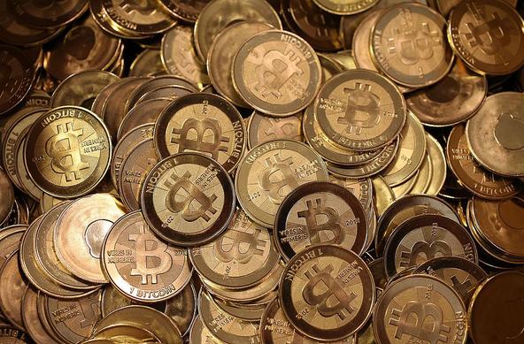 Pile of physical bitcoin tokens symbolizing BTC supply and accumulation