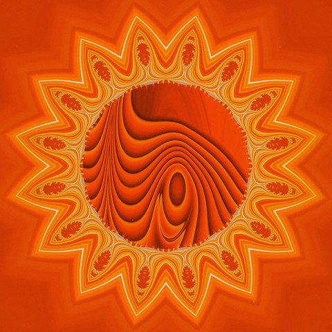 Ein 16 zackiges Mandala in orange - gelb Tönen.