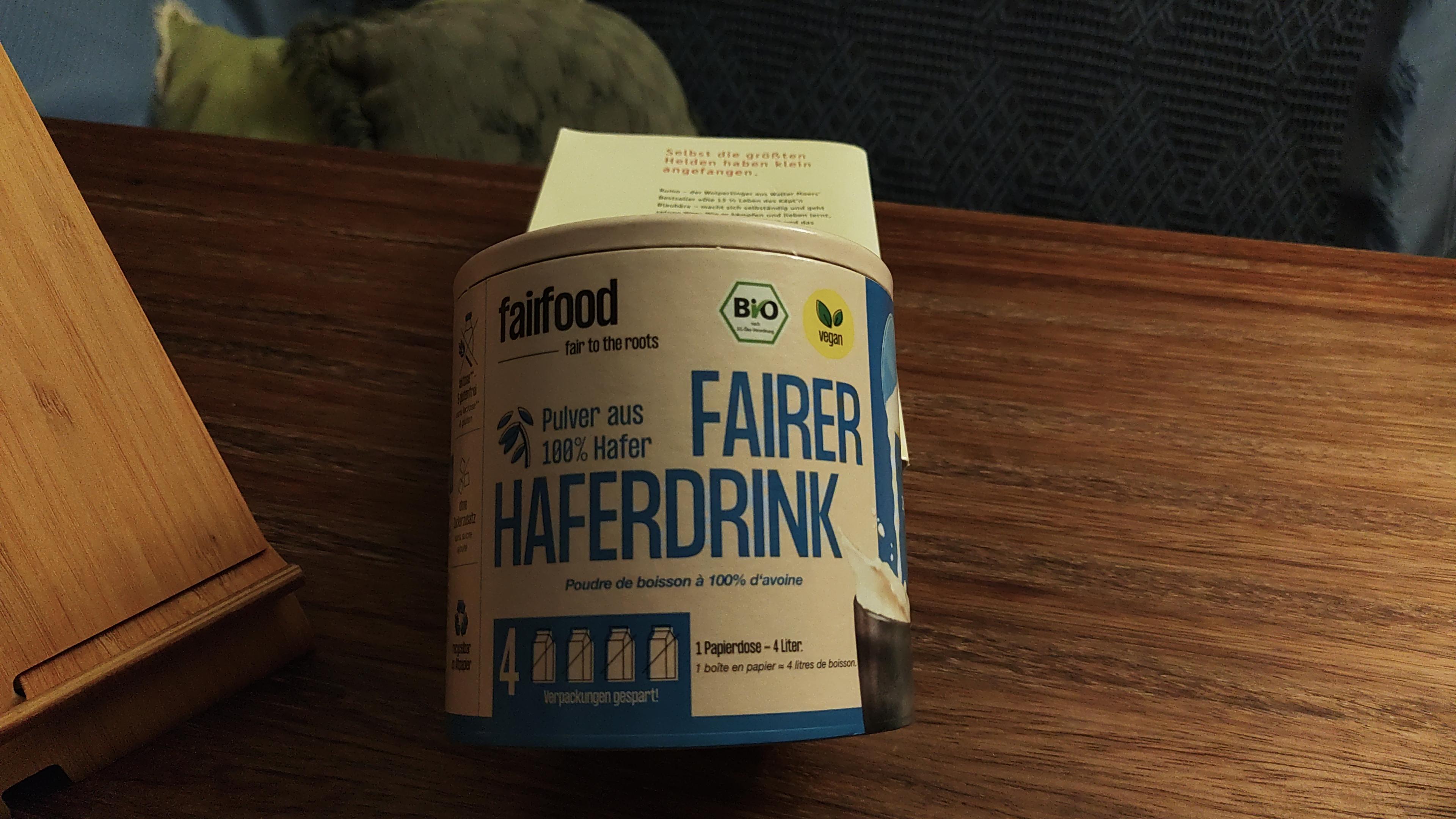 A can made of paper with oat powder